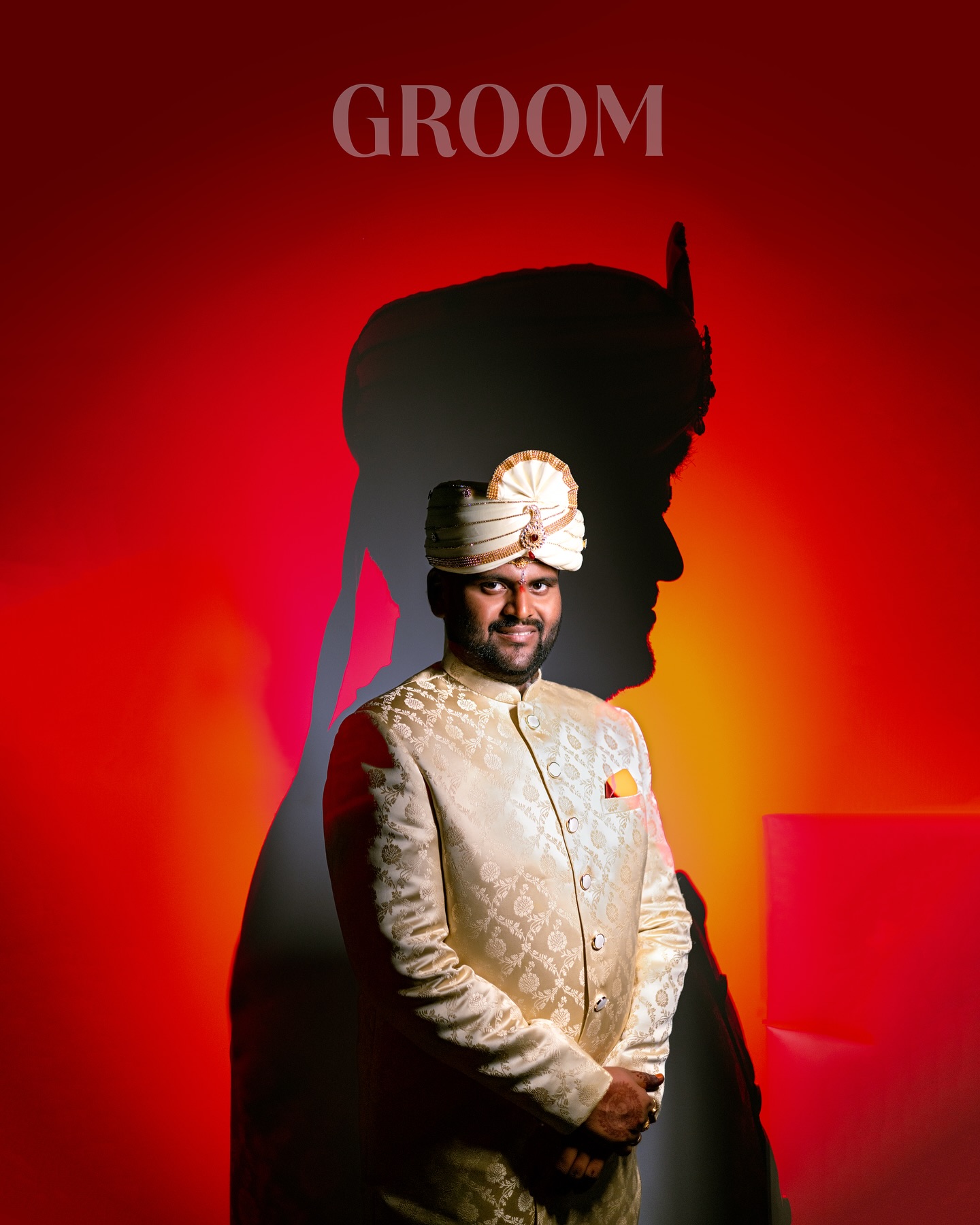 Dramatic groom portrait against red light by NAG Photography